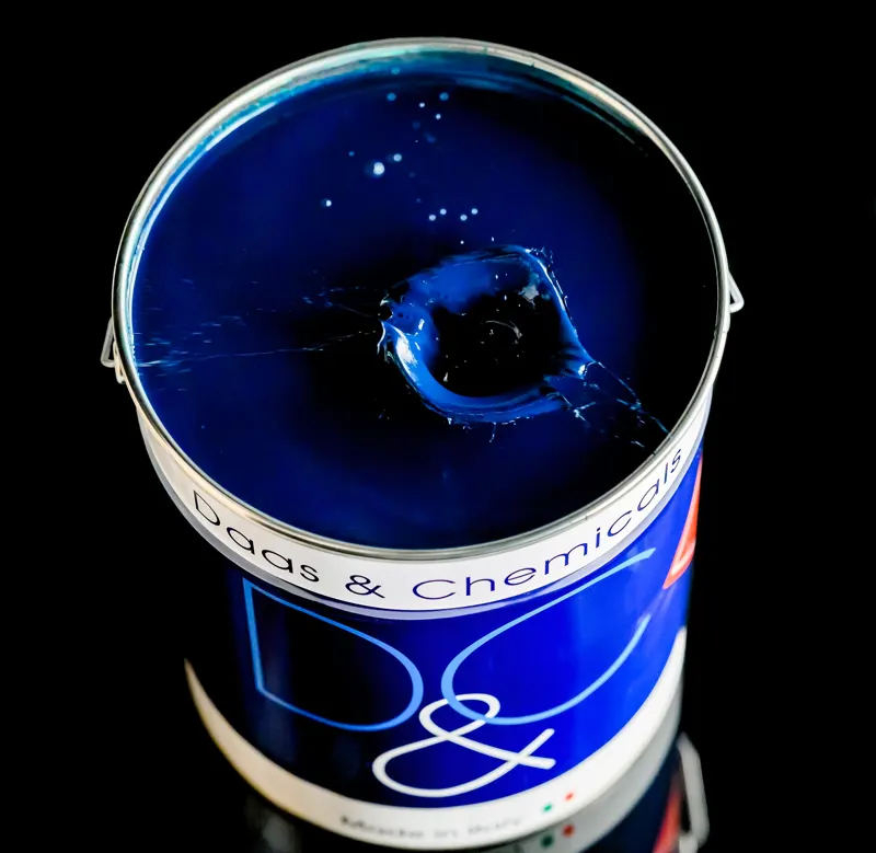 Open can of deep blue DAAS & Chemicals coating