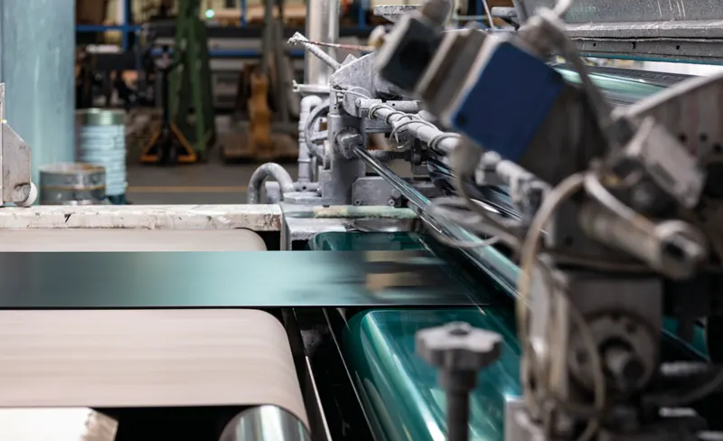 Coated glass panels on an industrial application line